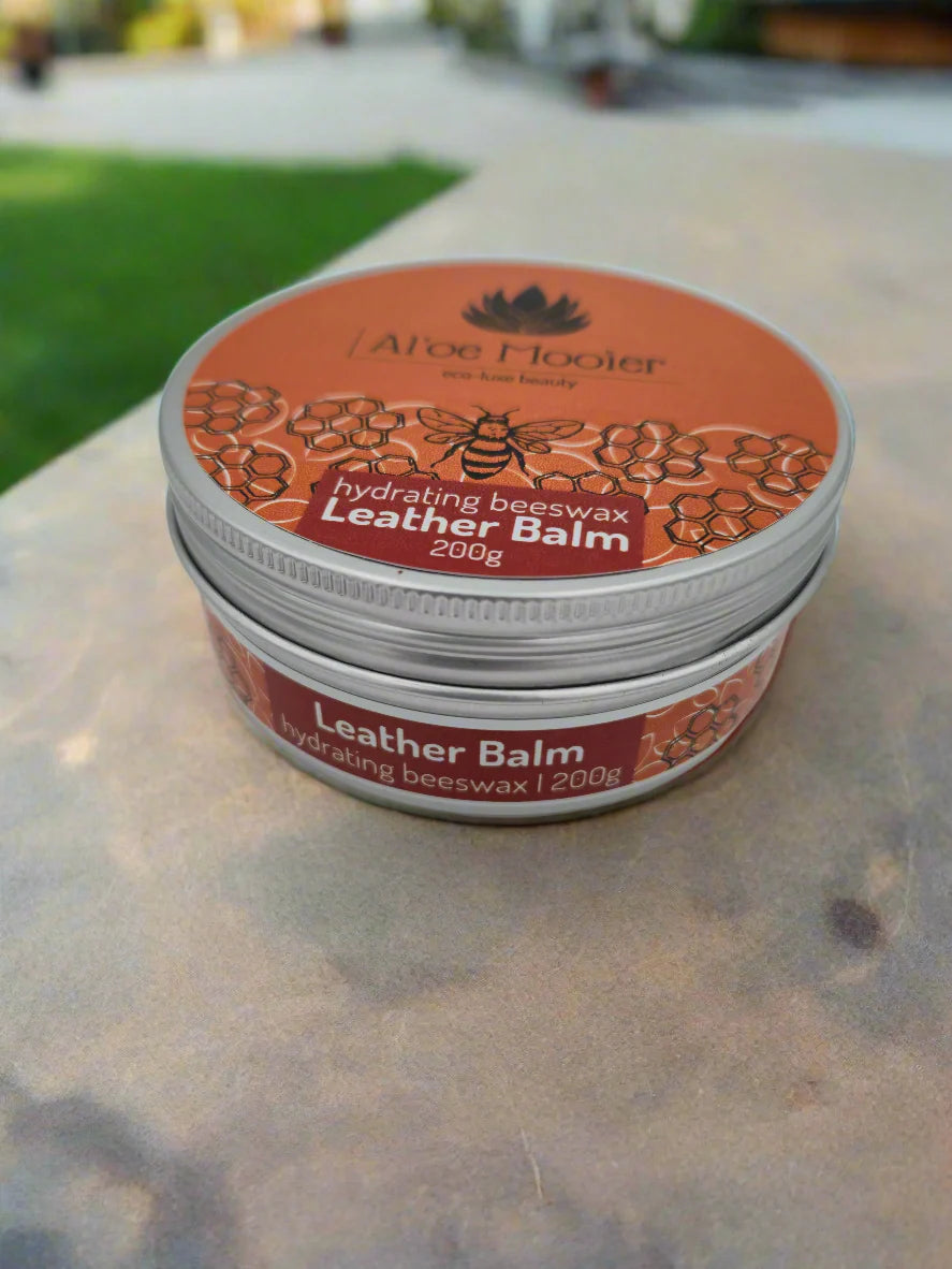 Two containers of Aloe & Co. leather balm on a white background