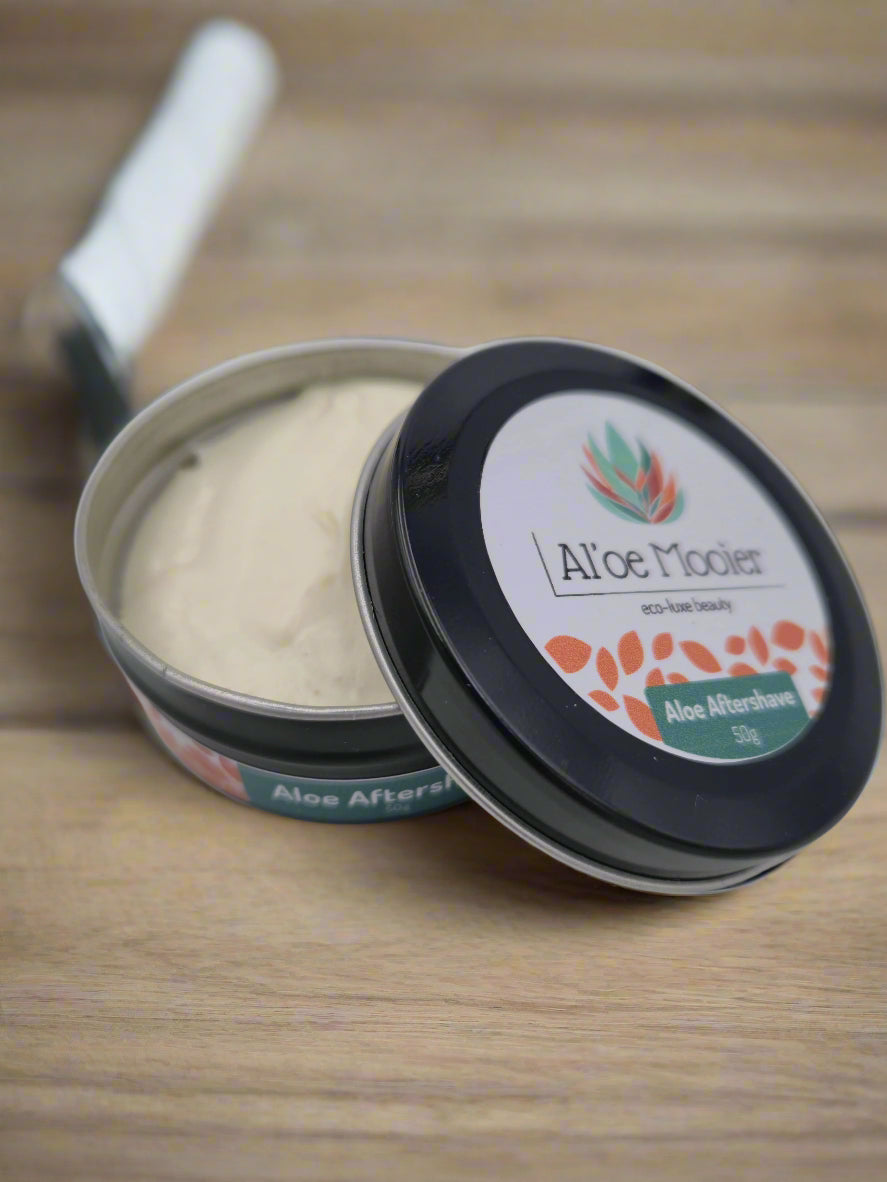 Aloe ferox after-shave balm in a metal tin with a black lid on a white background