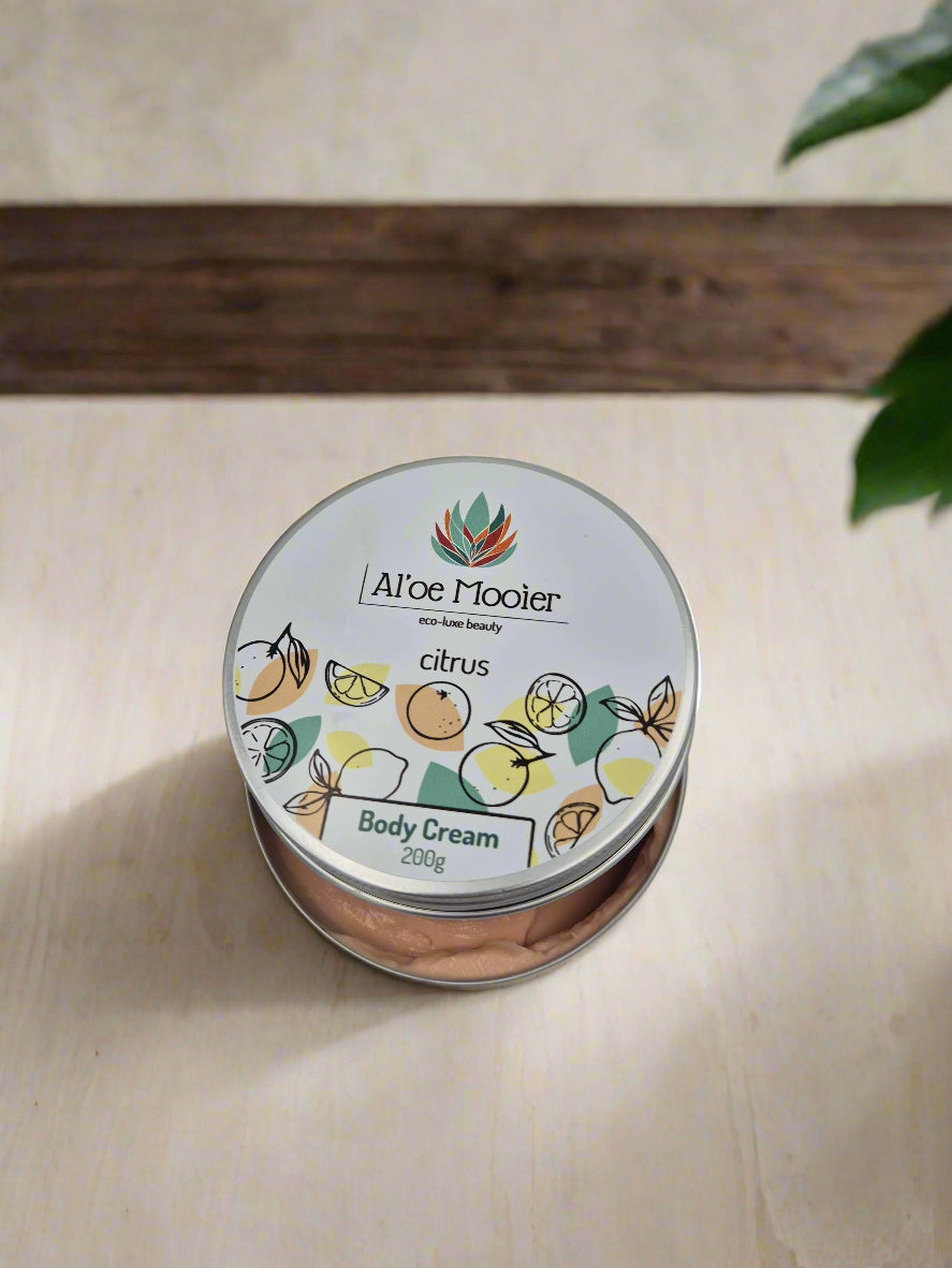 Jar of Aloe Mooier citrus body cream on a light gray background